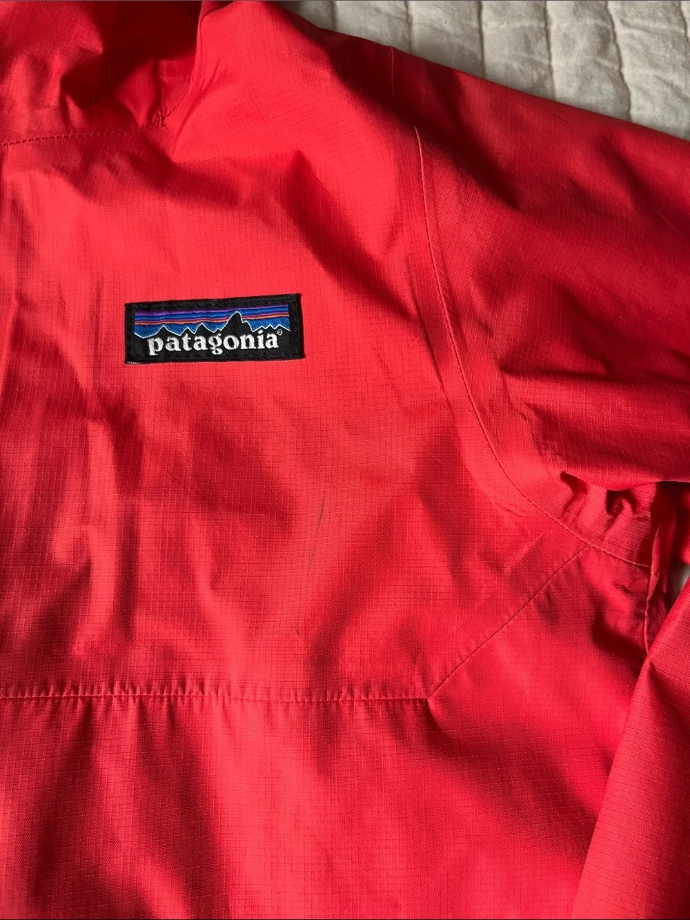 Patagonia Kids Coral-Red Hooded Raincoat with Reflective Trim